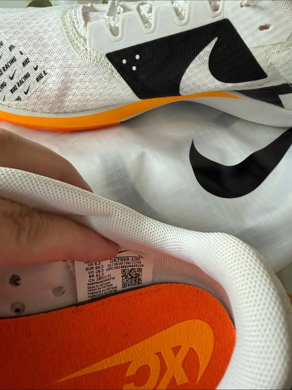 Nike men’s 10.5 track White Running Shoes with Orange and Neon Green Accents